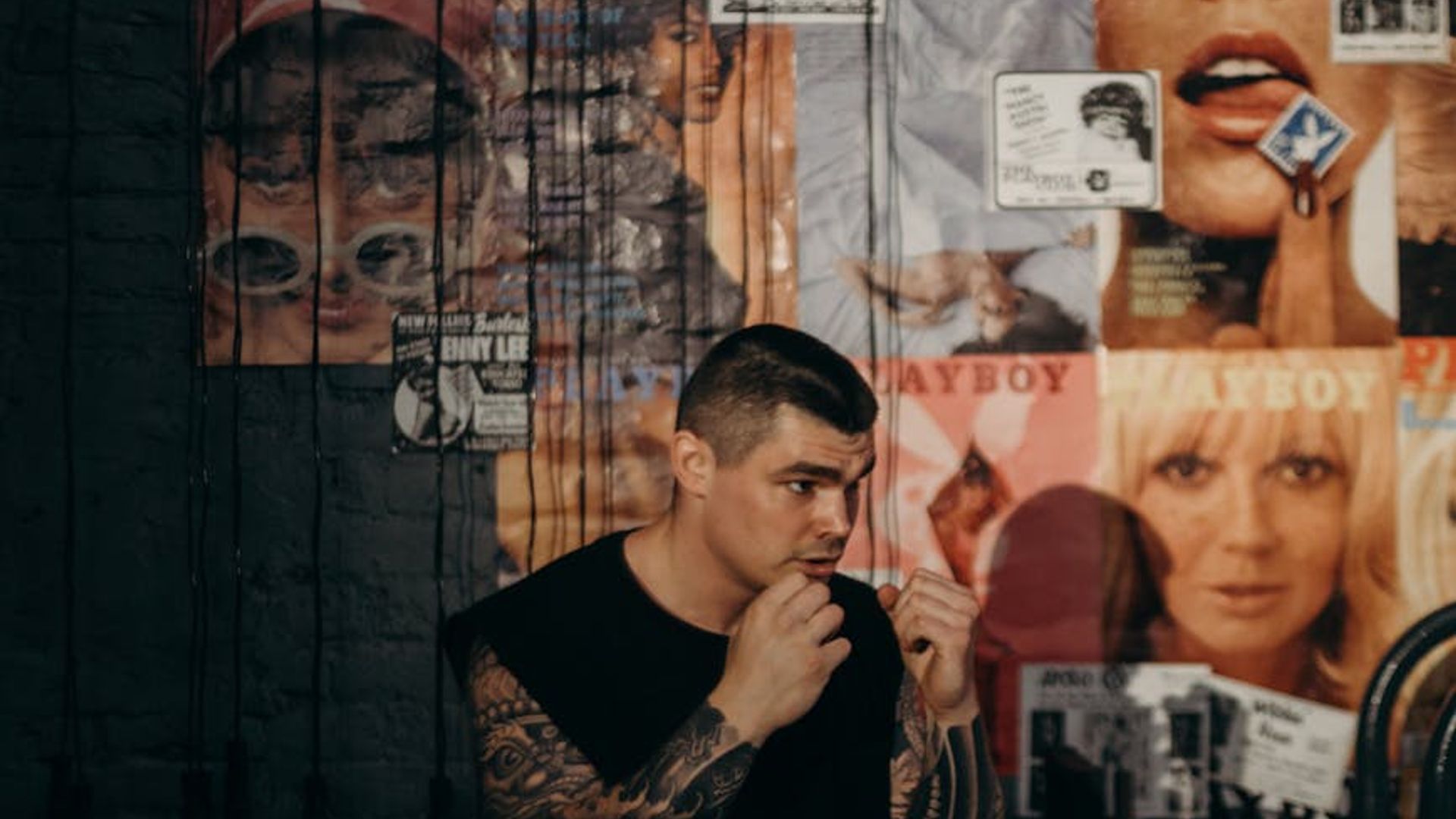 Man in a focused stance in a modern minimalist gym.